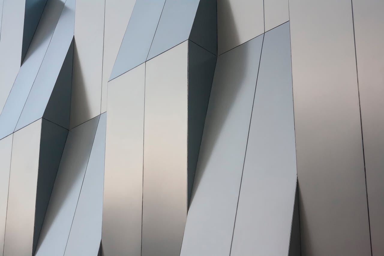 Detailed view of a modern geometric metal facade in Aguascalientes, Mexico.